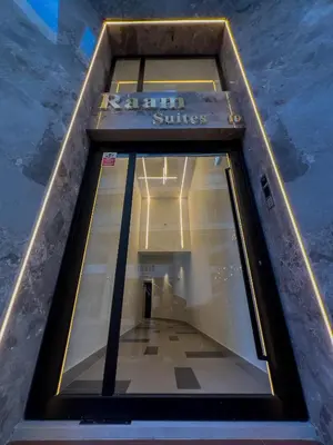 a window in a building with a sign on it at Raam Luxury Suites in Larnaka