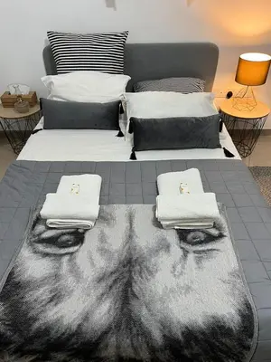 a bedroom with two beds with towels on them at HESTIA Studio Downtown Nicosia in Nicosia