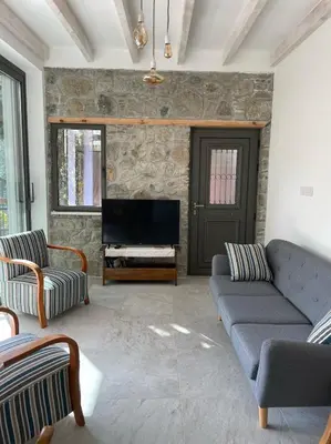 a living room with a couch and a piano at Balkoni Moutoullas in Moutoullas
