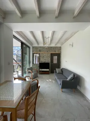 a living room with a couch and a table at Balkoni Moutoullas in Moutoullas