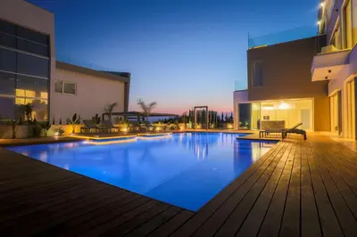 a swimming pool in the middle of a building at Cove Seaview Villas - Neptune in Ayia Napa