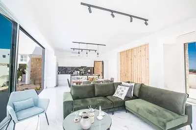a living room with a couch and a table at Vie Bleu 1 in Protaras
