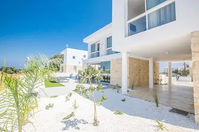 a white house with a patio in front of it at Vie Bleu 3 in Protaras