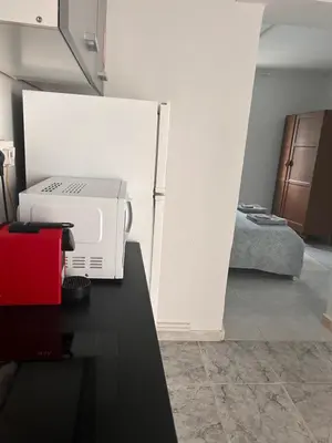 a room with a printer on a table and a bed at Avra House in Limassol
