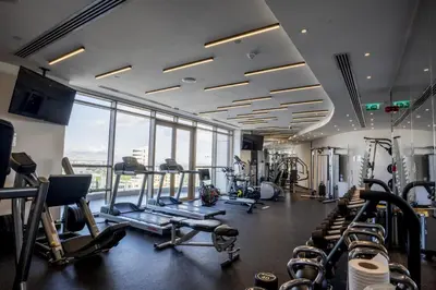 a gym with treadmills and cardio equipment in a building at 360 Nicosia - 2 bedrooms Luxury Residence in Nicosia