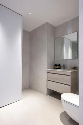 a bathroom with a sink and a toilet and a mirror at 360 Nicosia - 2 bedrooms Luxury Residence in Nicosia