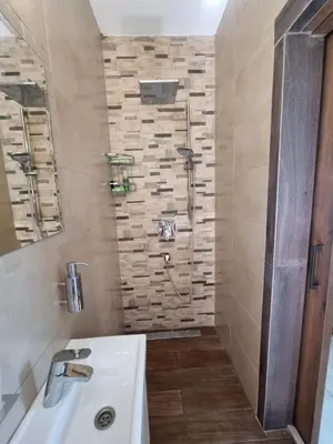 a bathroom with a sink and a shower at Mosaic villa by the sea in Protaras