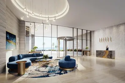 a living room with blue furniture and a large window at Del Mar Beachfront Boutique Residence in Limassol