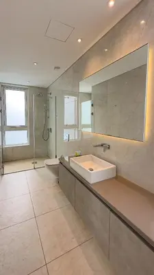 a large bathroom with a sink and a mirror at Vivo Mare Beachfront Villas - Vista in Ayia Napa