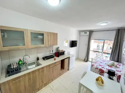 a kitchen with a sink and a counter top at Central Comfort Studio in Larnaka