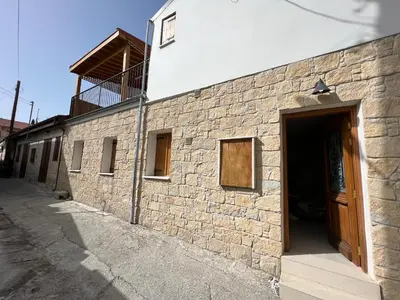 a brick building with a door on the side of it at Eftis - Renovated Traditional House in Omodos