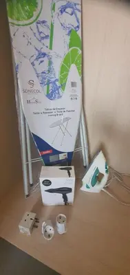 a table with a box and other items on it at STEFARIS PROPERTIES 'sioukris court' in Larnaka