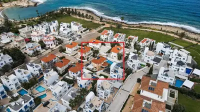 an aerial view of a village next to the ocean at Villa Elliana by Ezoria Villas in Protaras