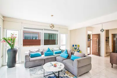 a living room with a couch and a table at Villa Mesogeios ME16 in Protaras