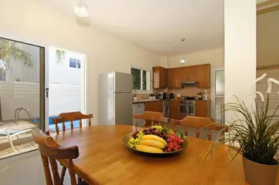 a bowl of fruit on a wooden table in a kitchen at Villa Clara in Protaras