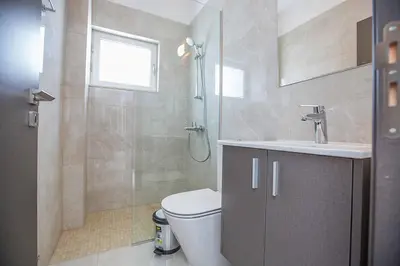a bathroom with a toilet and a sink and a shower at Olivine Pearl OL21 in Protaras