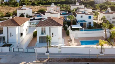an aerial view of a villa with a swimming pool at Pernera Gardens Villa in Protaras