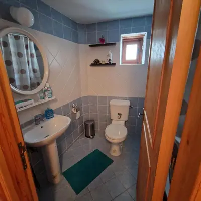 a bathroom with a toilet and a sink at THE ROCK HOUSE - Beautiful countryside with mandarins oranges and olive trees,. Near Limassol at Eptagonia village. in Ephtagonia
