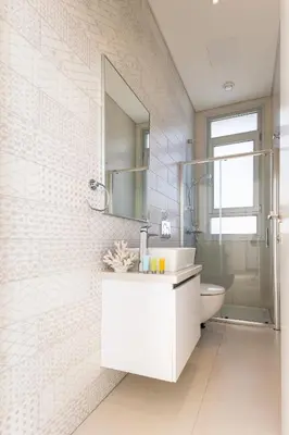 a white bathroom with a sink and a mirror at Napa Hills Seaview Villas - Iris in Ayia Napa