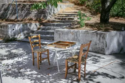 two chairs and a table and a table and two chairs at Legacy 1930s in Prodromos
