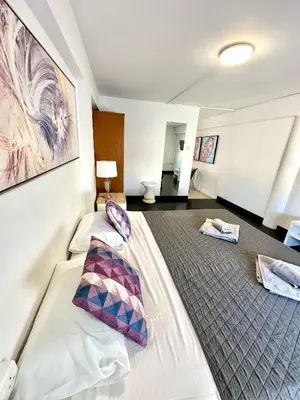 a hotel room with two beds with pillows at Harbour Seaside Escape in Ayia Napa