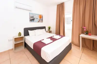 a bedroom with a large bed in a room at Villa White Star - 100m from Serena Beach in Protaras