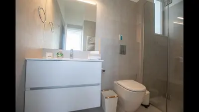 a bathroom with a toilet and a sink and a shower at Protaras Olivine Villa Ol3 in Protaras