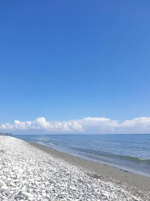 a sandy beach with the ocean in the background at Seafront Beach House in Meneou