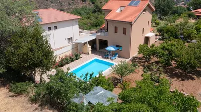 an aerial view of a house with a swimming pool at Kakopetria's Holiday House in Kakopetria