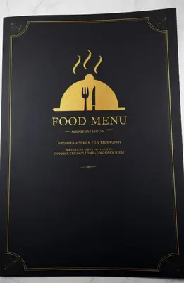 a black menu board with a fork and a food menu at Seaview Luxury Villa Fortuna in Ayia Napa