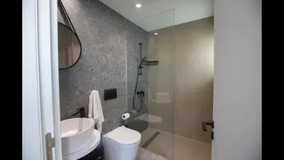 a bathroom with a shower and a toilet and a sink at Protaras Elite Pearl Villa Ep17 in Protaras