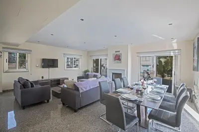 a living room with a table and chairs at Protaras Holiday Villa Dv1 in Protaras