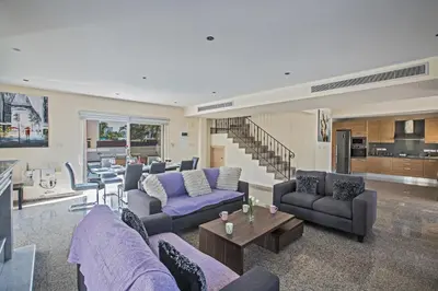 a living room with purple couches and a table at Protaras Holiday Villa Dv1 in Protaras