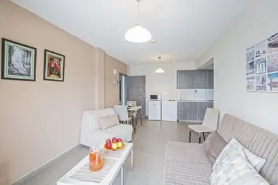a living room with a couch and a table at Ayia Napa Holiday Apartment So7 in Ayia Napa