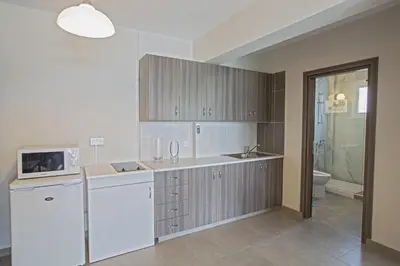 a kitchen with a sink and a microwave at Ayia Napa Holiday Apartment So7 in Ayia Napa