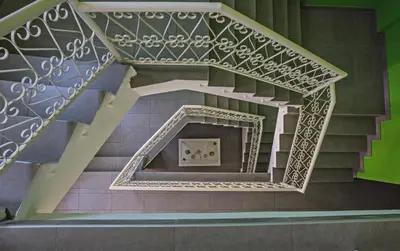 a spiral staircase in a building with purple stairs at Ayia Napa Holiday Apartment So1 in Ayia Napa