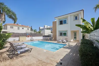 a swimming pool in the backyard of a house at Protaras Holiday Villa Dv27 in Protaras