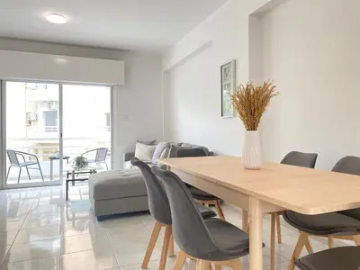 a dining room with a table and chairs at Phaedrus Living Down Town Flat Nestoras 301 in Limassol