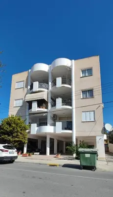 a large apartment building on the side of a street at Zinas modern flat Nicosia in Strovolos