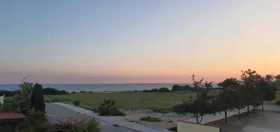 a view of the ocean from the balcony of a house at Sunset Sea View Villa in Ayia Napa