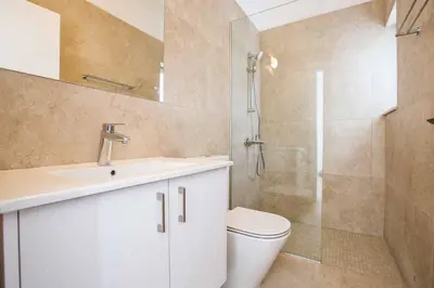 a bathroom with a toilet and a sink and a shower at Olivine Pearl OL20 in Protaras