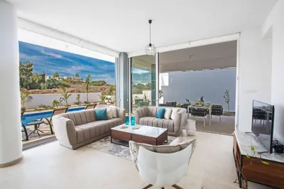 a living room with a view of the ocean at Olivine Pearl OL20 in Protaras
