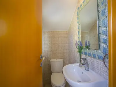a bathroom with a toilet and a sink at Protaras Villa Amber By The Sea in Protaras