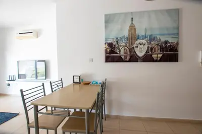 a dining room with a table and chairs at Glabur Stays - The Master Atelier - Nicosia City, Free Parking & Wifi, Welcomes You!!! in Nicosia