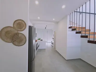 a hallway of a house with white walls and stairs at STAY Anemone 19 in Protaras