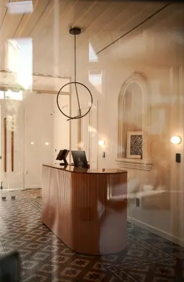 a lobby with a desk with a laptop on it at Heart Hotel in Limassol