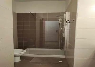 a bathroom with a shower and a toilet at Villa Poseidon in Pervolia