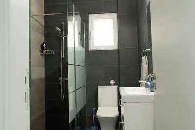a bathroom with a toilet and a sink at ALEX APARTMENT in Strovolos