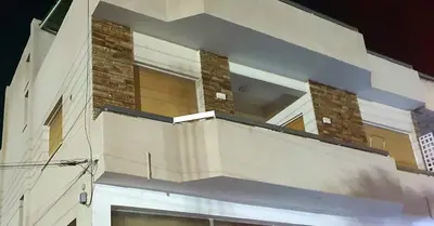 a building with a balcony on the side of it at Zelea Deluxe Apartment (BREAKBOOKING CY) in Limassol