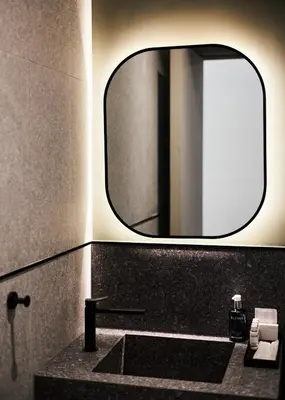 a bathroom with a sink and a mirror at Alinea Primo Historic Center in Limassol